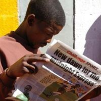 African man reading